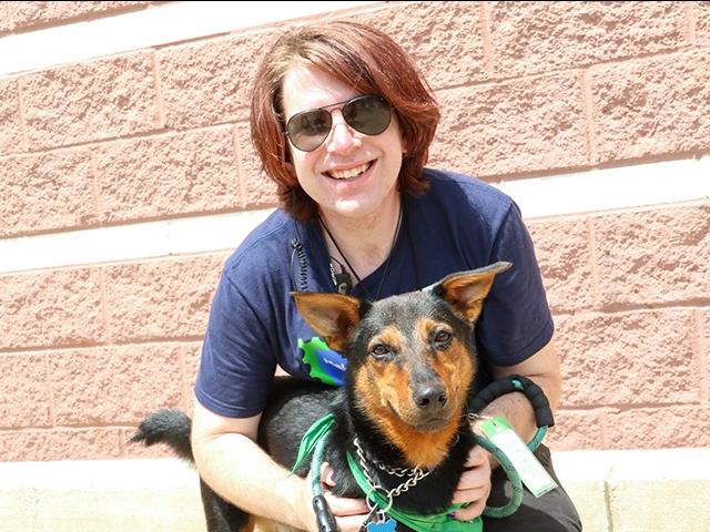 Brenden Hoehn holding his rescue dog Loki