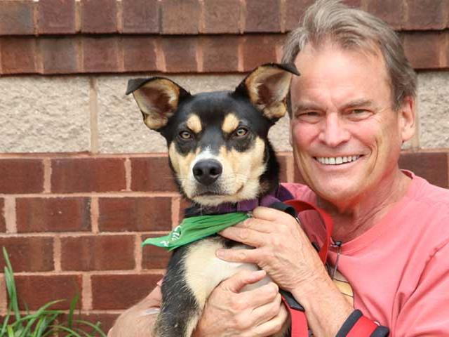 Chip Reid, Lucky Dog Animal Rescue Volunteer with a rescue dog
