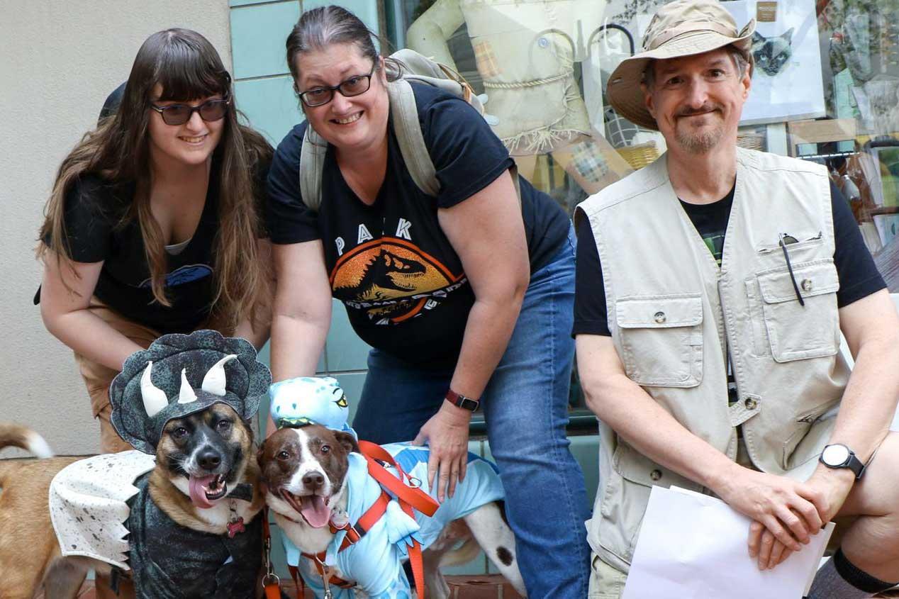 Family and pets dressed up like characters from Jurassic Park