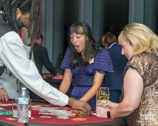 Woman winning big at blackjack.