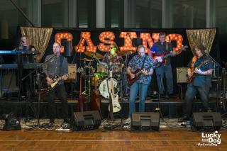 Band plays in front of a light up Casino sign