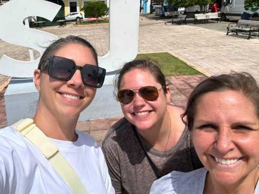 A collage of volunteers with puerto rican rescue puppies